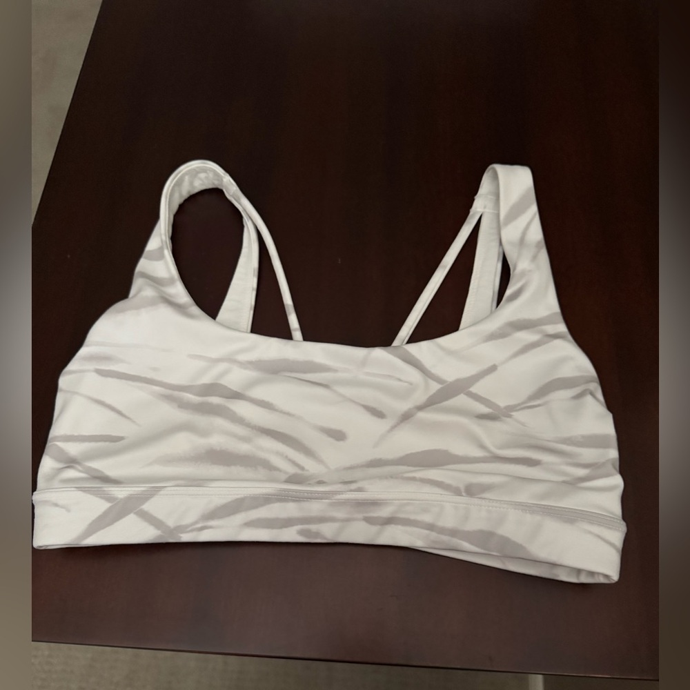 Athleta Exhale sports bra in a white and gray zebra print. Size S